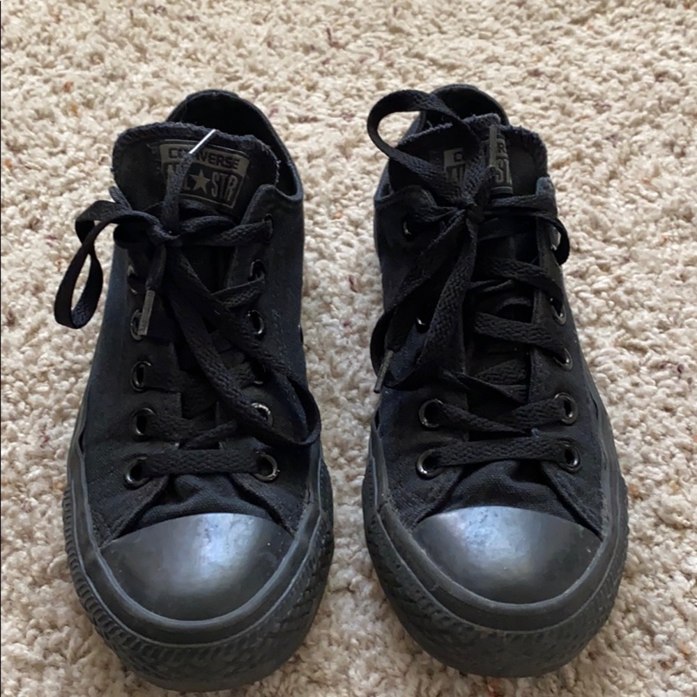 All black women’s low top Converse.
